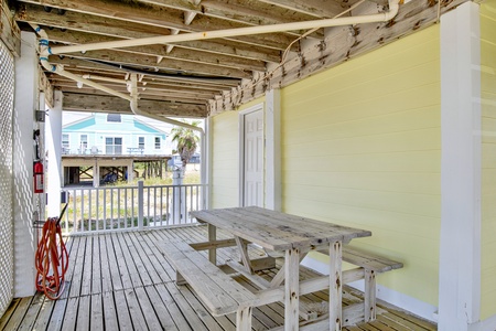 Shaded picnic area under home