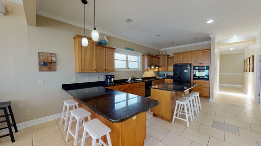 2nd floor  kitchen with granite counter tops and stainless steal appliances. Bar seating for 3 and Island seating for 3.