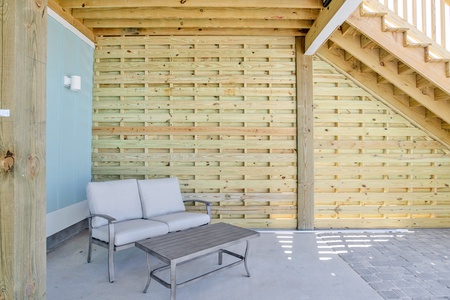 Covered area under both sides of the home near the pool deck