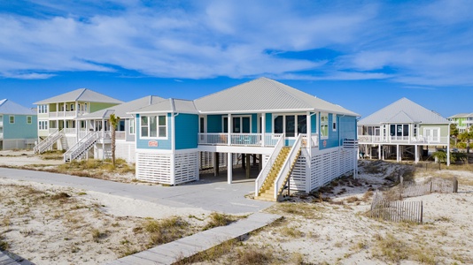 Beach boardwalk directly off front steps of your home!