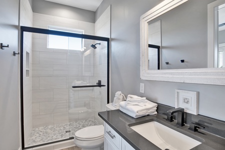 The private bath in bedroom 3 has a walk-in shower