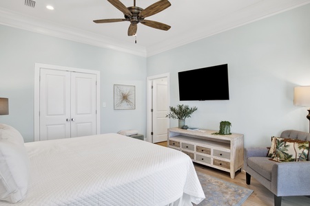 Bedroom 1 features a king bed and a television