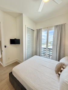 Bedroom 2 offers a TV and Queen bed, sleeps 2