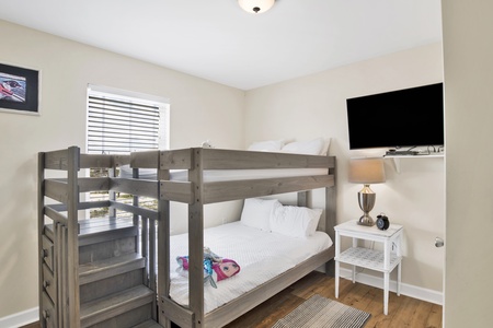 Guest bedroom 3 offers a Full over Full bunk bed and TV