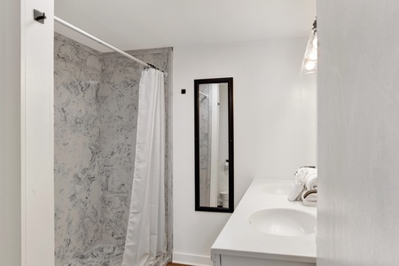 Featuring a walk-in shower