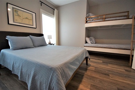 Bedroom 2, queen bed, 2 twin bunks, sleeps 4, TV, attached bath