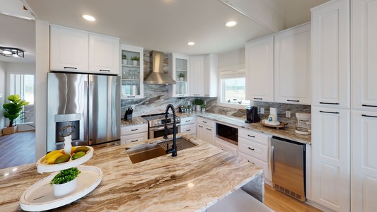 Stainless steel appliances with beautiful countertops you won't mind being in the kitchen