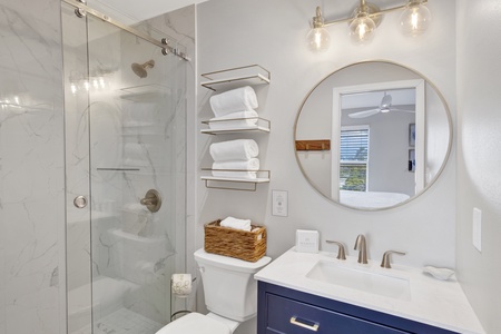 The private bathroom features a walk-in shower
