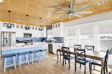 Seating for 6 at the dining room table with additional seating at the bar