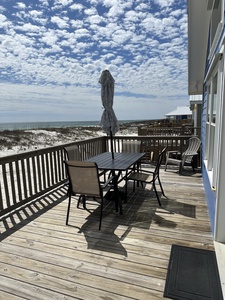 Deck with table and grill for outdoor meals