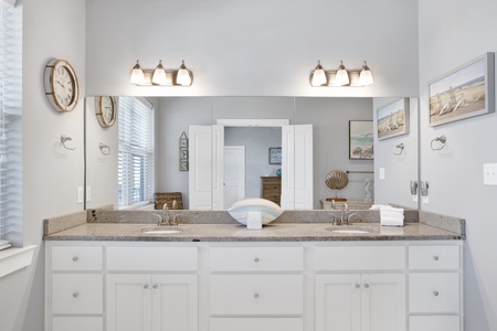 The private bathroom has dual vanities