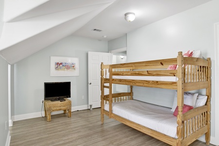 This guest bedroom sleeps 6 guests and shares the Jack and Jill bathroom