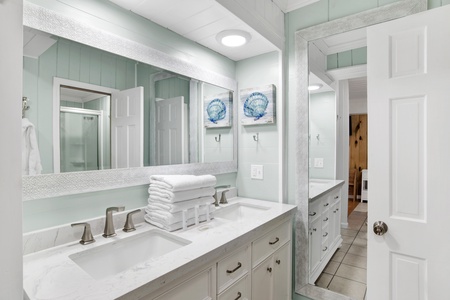 Full bathroom with a double vanity in the suite