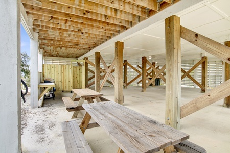 Covered picnic and grilling area under the home