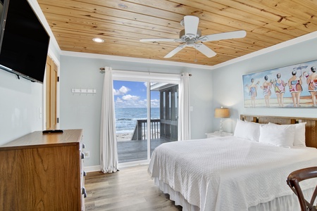 Guest bedroom 1 has a TV and balcony access