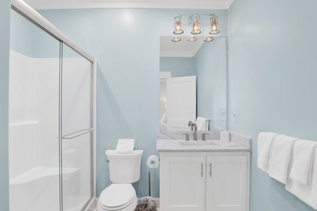 The private bathroom features a walk-in shower
