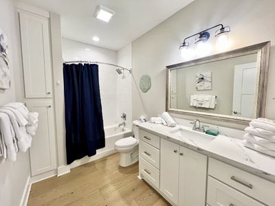 The shared hall bath has a tub/shower combo