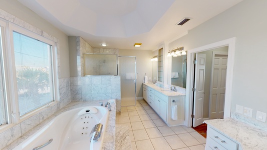 The Master bathroom comes with a double vanity, jetted tub and walk-in shower