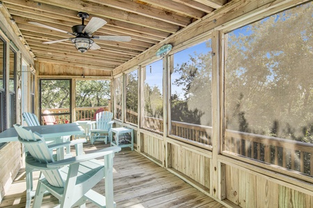 The screened in porch has plenty of seating