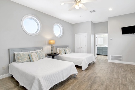 Loft bedroom with two queens and a TV