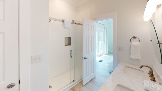 The bathroom in bedroom 3 has a large walk-in shower