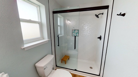 Private bath for bedroom 2 with a walk-in shower