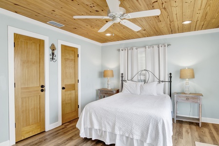 The master bedroom has a Queen bed, sleeping 2 guests