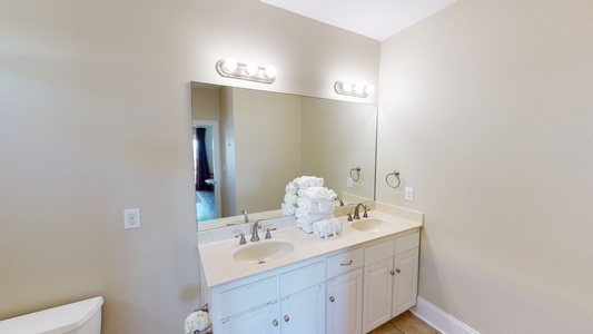 The private bathroom in bedroom 2 has a double vanity