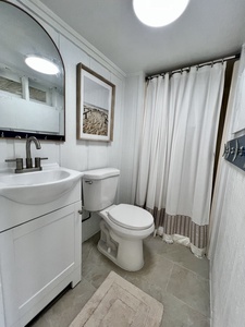 There is an additional shared bathroom downstairs with a walk-in shower