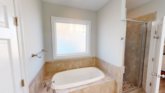 There is also a soaking tub in the private bath in Bedroom 6