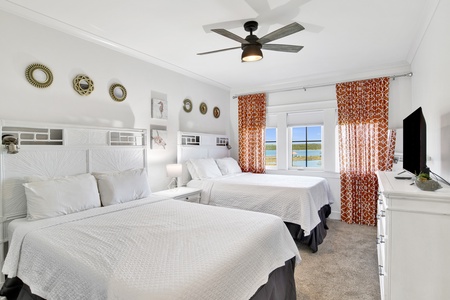 Bedroom 4 offers a TV and 2 Queen beds, sleeps 4