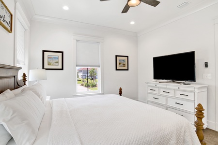 The master bedroom has a TV and King bed, sleeps 2