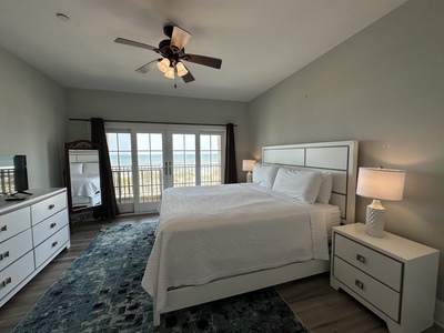 Bedroom 2 on the 2nd floor sleeps 2 in a king bed. The room gas a TV, Gulf views, balcony access and a private bathroom