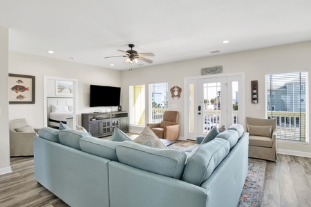 Open concept living area with wall-mounted TV