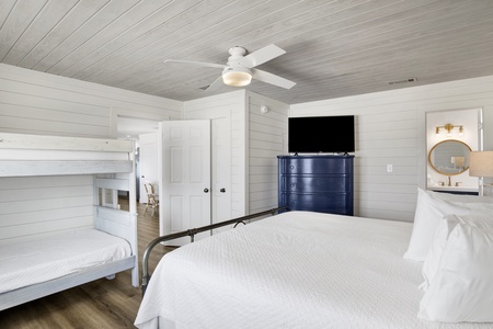 The primary bedroom has a TV and private bathroom