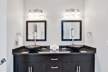 The private bathroom has dual vanities