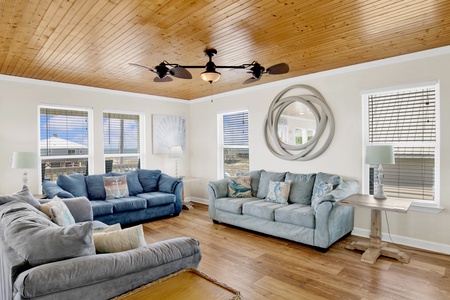 The living room is spacious and offers plenty of seating