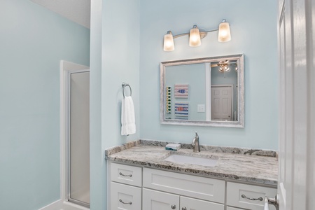 2nd floor private guest bathroom with a walk-in shower