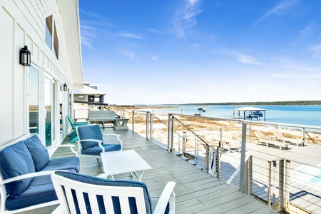 Lagoon facing deck with stairs to the pool deck