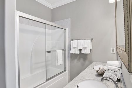 The shared hallway bathroom features a tub/shower combo