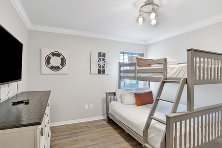 Guest bedroom 2 offers a twin over full bunk bed and TV