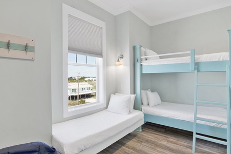 Guest bedroom sleeps 5 guests and features a TV