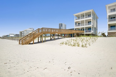 The home has a beach walkover and it's identical twin, Somewhere in Sand 1, is next door