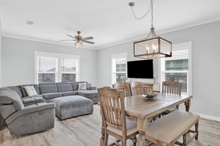 Open living content with seating for 6 at the dining table