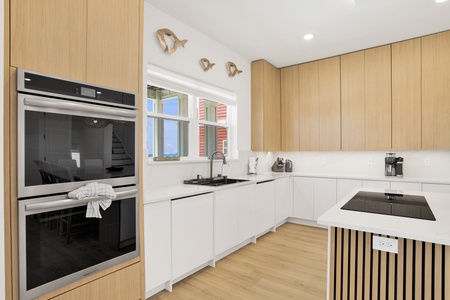 The stunning, modern kitchen is fully equipped
