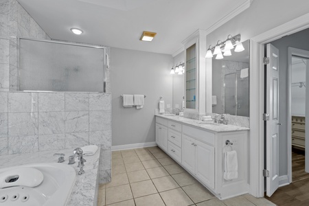 The Master bathroom comes with a double vanity, jetted tub and walk-in shower