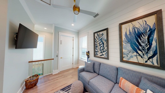 This living area has elevator access and a mounted TV