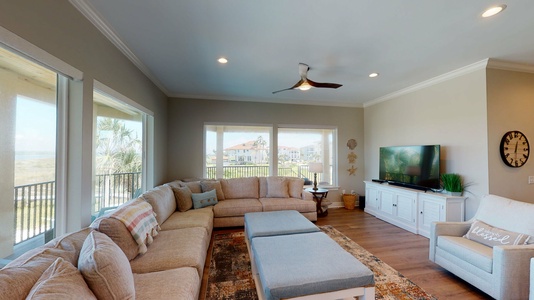 Livingroom area with plenty of seating and a flat-screen TV