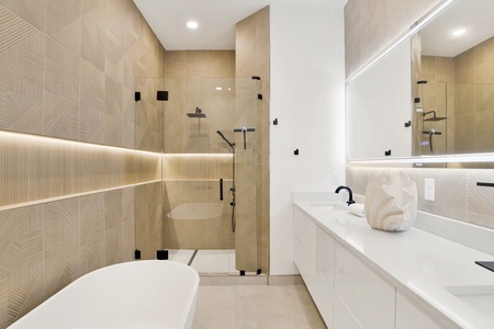 Featuring a stunning walk-in tile shower