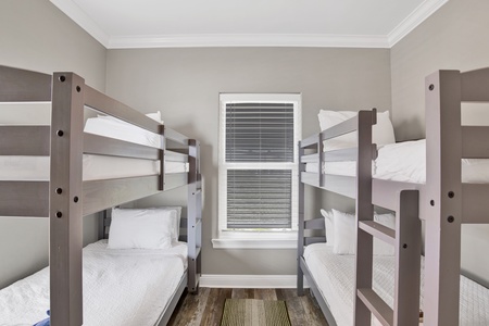 Bedroom 4 has a TV and two sets of Twin bunk beds, sleeps 4